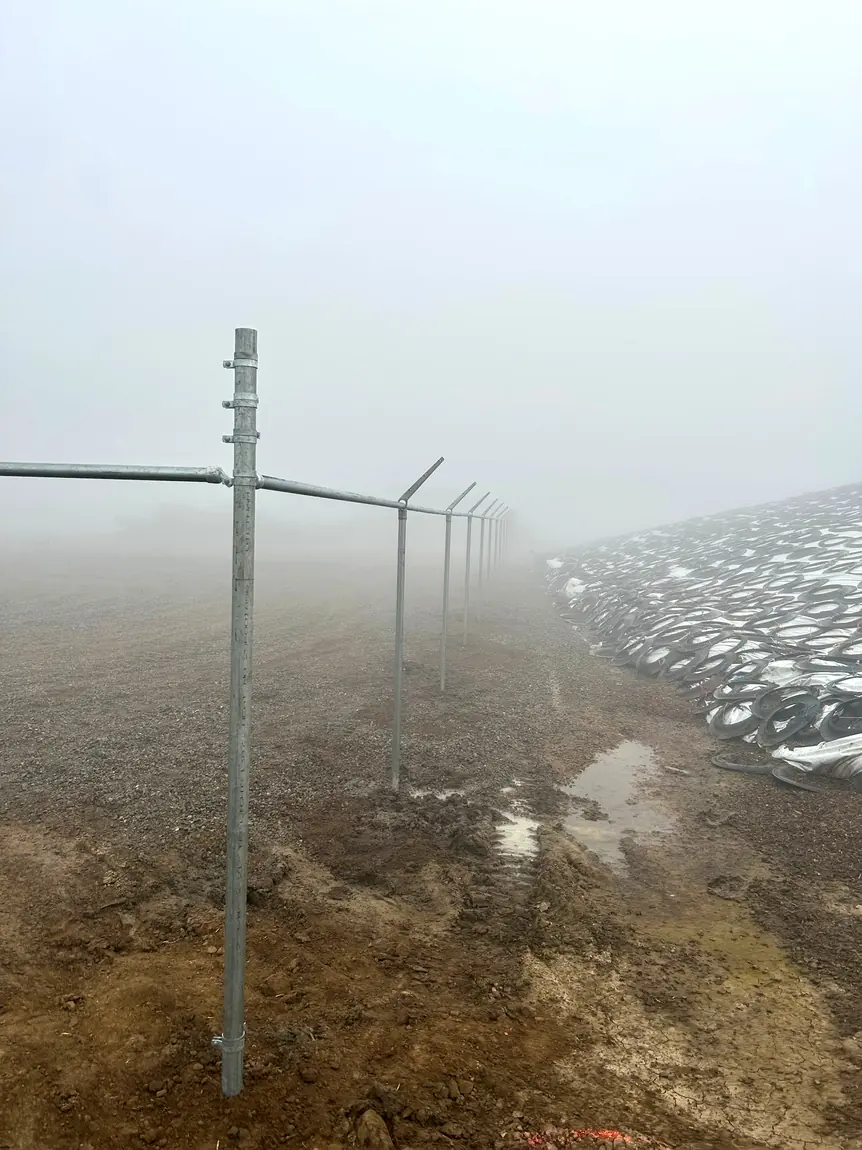 Long chain-link project in fog