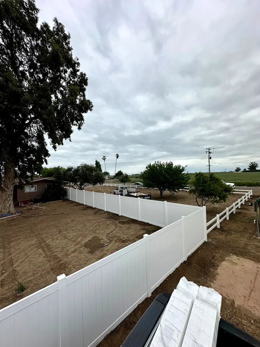 White vinyl property fence