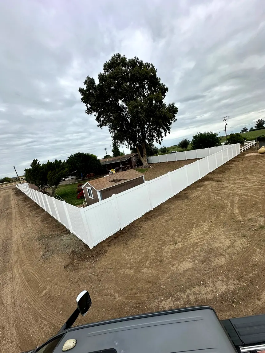 White vinyl fence around a property